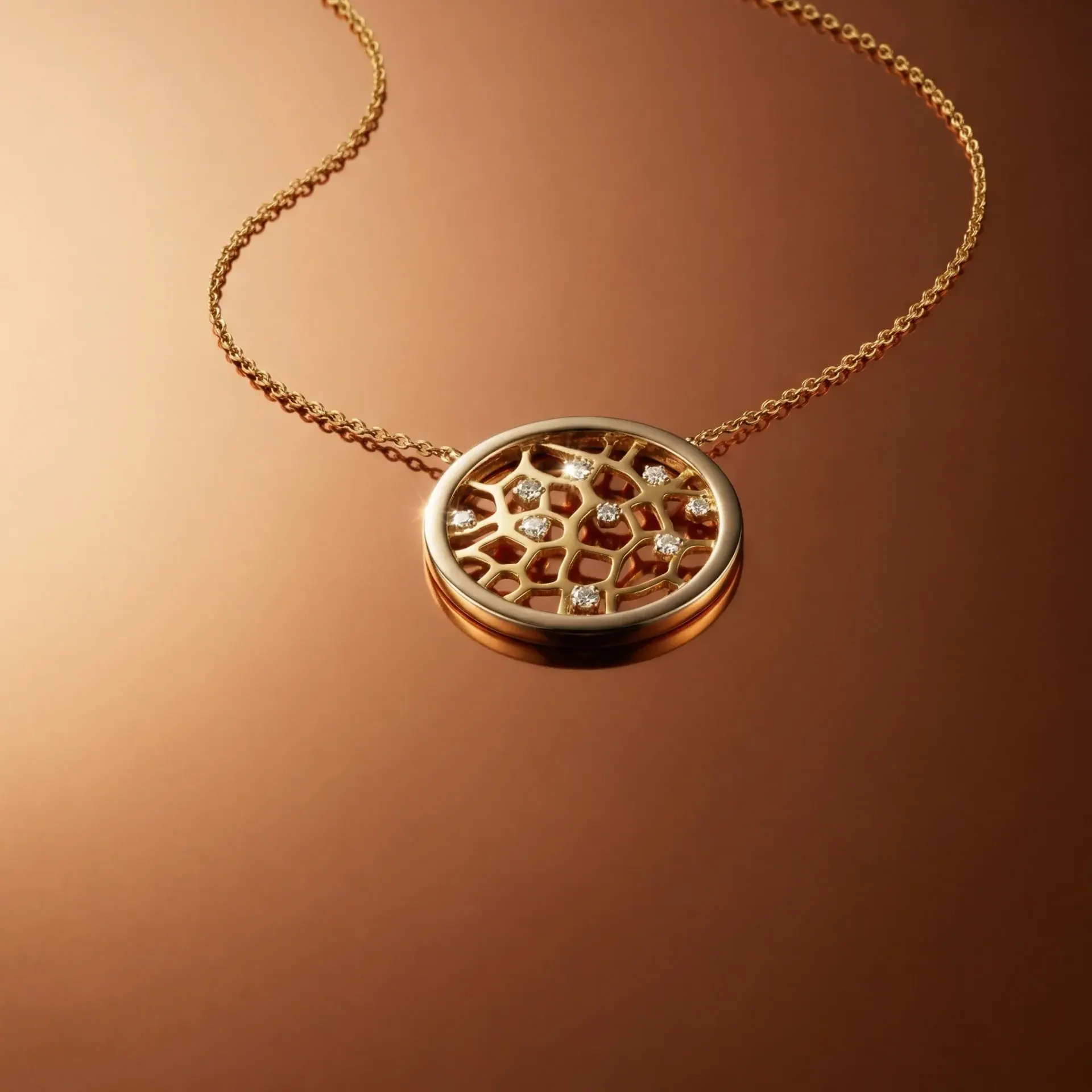 The gold filigree pendant on a copper background