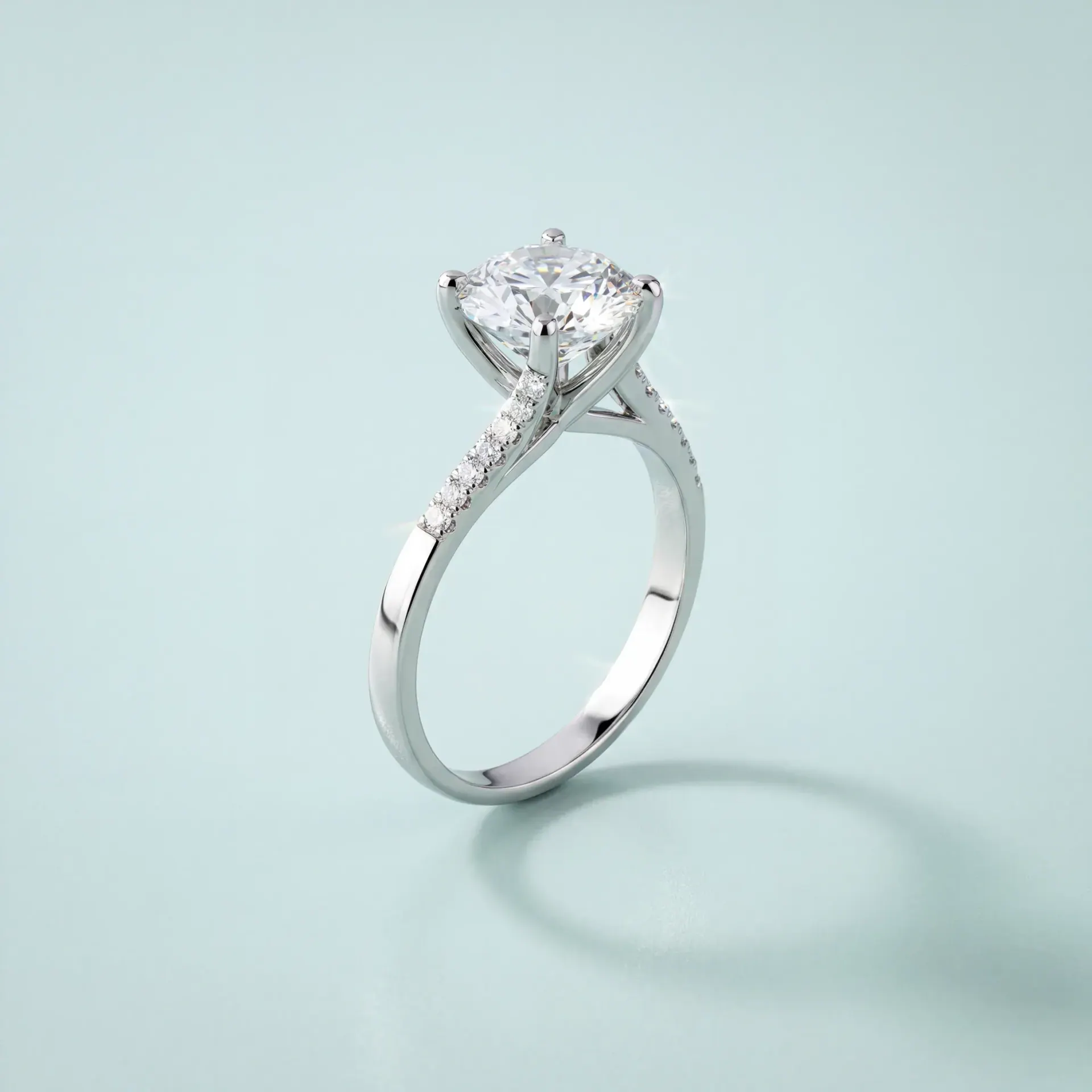 The solitaire ring rendered in white metal on pale blue